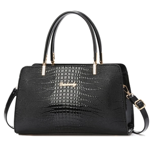 Minimalist black faux crocodile tote bag with gold logo and adjustable shoulder strap