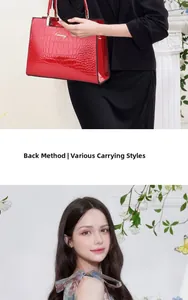Detail of red crocodile pattern handbag with gold hardware and multiple carrying styles