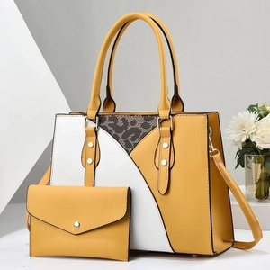 Dettaglio borsa tote color block con inserto leopardato e portafoglio abbinato