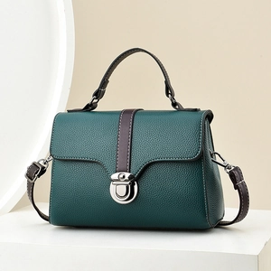 Dark green lychee texture leather handbag with brown strap and silver metal buckle