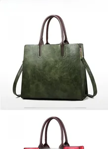 Detailed view of Army Green and Wine Red leather tote bags with dual handles and straps