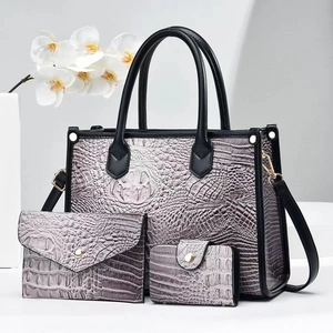 Three-piece crocodile pattern handbag set with tote, clutch and wallet in purple-grey