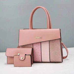 Detail of pink PU tote bag set featuring ostrich and lizard skin texture patchwork