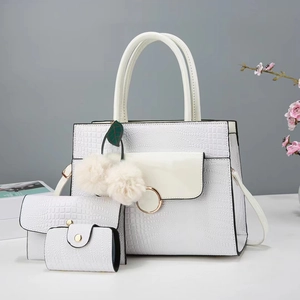 White three-piece tote bag set with crocodile pattern and decorative leaf charm