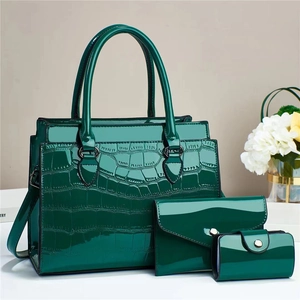 Deep green faux crocodile leather 3-piece bag set with tote, wallet, and cylinder pouch