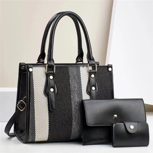 Three-piece women's tote set with black and white vertical stripes and leather trim