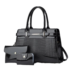 Three-piece black glossy faux crocodile tote bag set with gold hardware and wallets