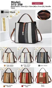 Detailed view of striped bucket bag with 23x12x21cm dimensions and adjustable shoulder strap
