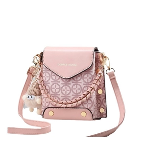 Pink PU leather crossbody phone bag with four-leaf clover pattern and plush charm