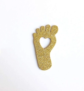 Glittery gold baby feet paper confetti with heart cutout for gender reveal party DIY