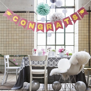 Pink and gold glitter CONGRATS banner with doctoral caps for graduation party decoration