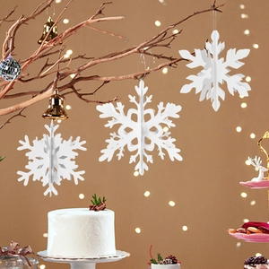 3D white snowflake ornaments with cutout design hanging for Christmas tree window decor