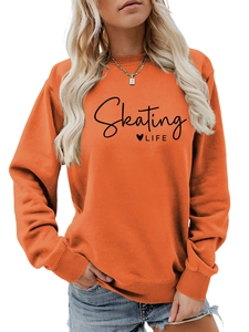 Detail of the Skating LIFE text print and heart design on this orange long sleeve sweatshirt