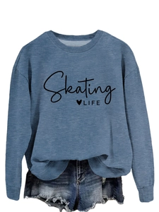 Detail of blue crewneck sweatshirt featuring black Skating LIFE text and heart graphic