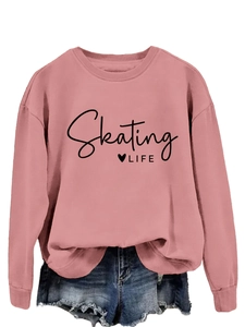 Detail view of pink crewneck sweatshirt with black Skating LIFE lettering and heart print