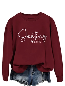 Detail of red Skating Life sweatshirt paired with frayed denim shorts in a flat lay view