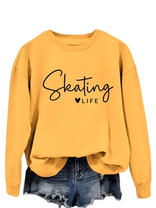 Detail of yellow sweatshirt featuring Skating Life print and ribbed cuffs for a casual look