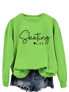 Detail of green Skating LIFE graphic sweatshirt with ribbed neckline and casual fit