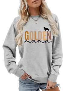 Detail of the Golden Mama text and golden retriever silhouette on a grey sweatshirt