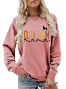 Detail view of the Golden Mama print with a golden retriever silhouette on a pink sweatshirt
