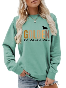 Detail of mint green sweatshirt featuring Golden mama text and golden retriever silhouette