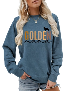 Close-up of Golden Mama print on blue long sleeve sweatshirt with dog silhouette