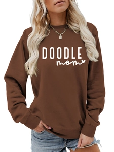 Detail of DOODLE MOM text print on brown long sleeve sweatshirt with crew neck