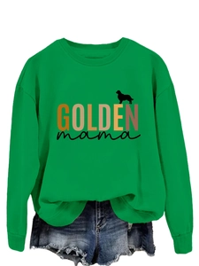 Detail of the Golden Mama emerald green sweatshirt featuring a golden retriever silhouette
