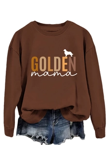 Close-up of brown Golden Mama long sleeve sweatshirt with gradient text and dog silhouette