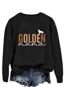 Detail of a black long-sleeve T-shirt with GOLDEN mama text and a golden retriever silhouette