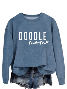 Detail of the blue round neck sweatshirt featuring white DOODLE mom graphic print