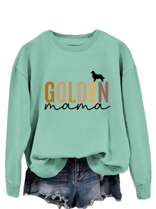 Detail of mint green sweatshirt featuring Golden Mama print and drop shoulder sleeves