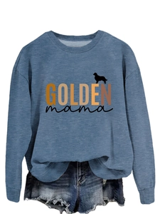 Detail of GOLDEN mama text and golden retriever silhouette on blue long sleeve sweatshirt