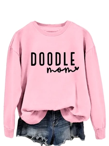 Detail view of pink crewneck sweatshirt with black DOODLE mom letter print decoration