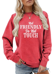 Close-up of red crew neck sweatshirt with white 'Not Friendly Do Not Touch' print