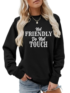 Detail of Not Friendly Do Not Touch print on black crewneck sweatshirt for women