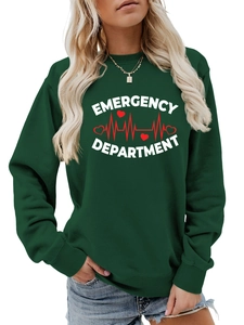 Close-up of Emergency Department print on dark green crewneck sweatshirt fabric