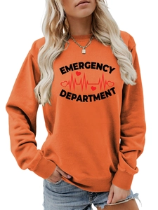 Detail of emergency department lettering and red heart pattern on orange sweatshirt