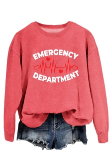 Close-up of Emergency Department heart print on a red crewneck sweatshirt with denim shorts