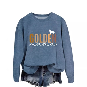 Women's blue long sleeve GOLDEN mama sweatshirt paired with distressed denim shorts