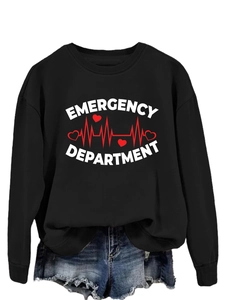 Detailed view of Emergency Department print on a black crewneck sweatshirt with blue denim shorts