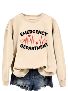 Close-up of Emergency Department print on apricot sweatshirt with heart rate monitor detail