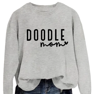 Grey loose round neck sweatshirt featuring Doodle Mom script print and heart detail