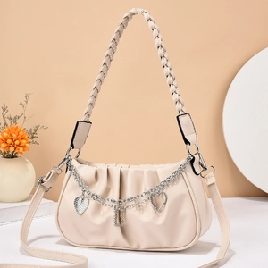 Chic beige ruched cloud bag with woven handle and crystal heart chain strap