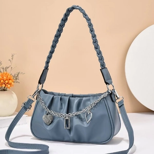 Morandi blue pleated cloud bag with woven handle and metallic chain heart charms