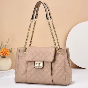 Beige quilted chain shoulder bag with elegant gold hardware and turn-lock closure