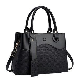 Chic black women's handbag with woven texture and gold-tone hardware on white background