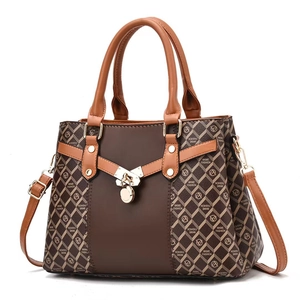 Modern brown leather handbag with diamond pattern canvas and gold buckle closure