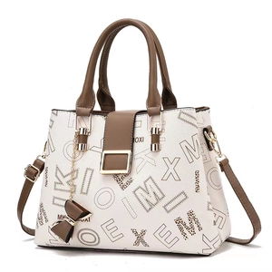Elegant white and brown leather handbag with leopard print letter patterns and bow charm