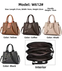 Detail view of large quilted PU leather bag with metal buckle and multi-compartment interior